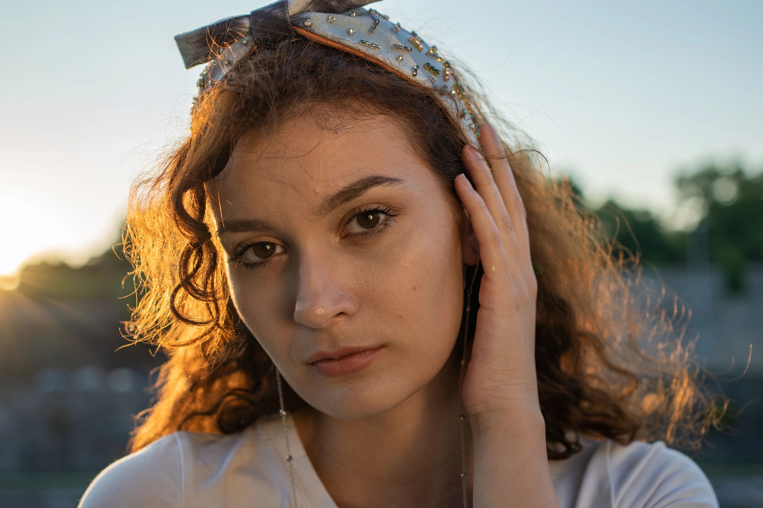 Portrait of a woman against a dreamy star-inspired backdrop