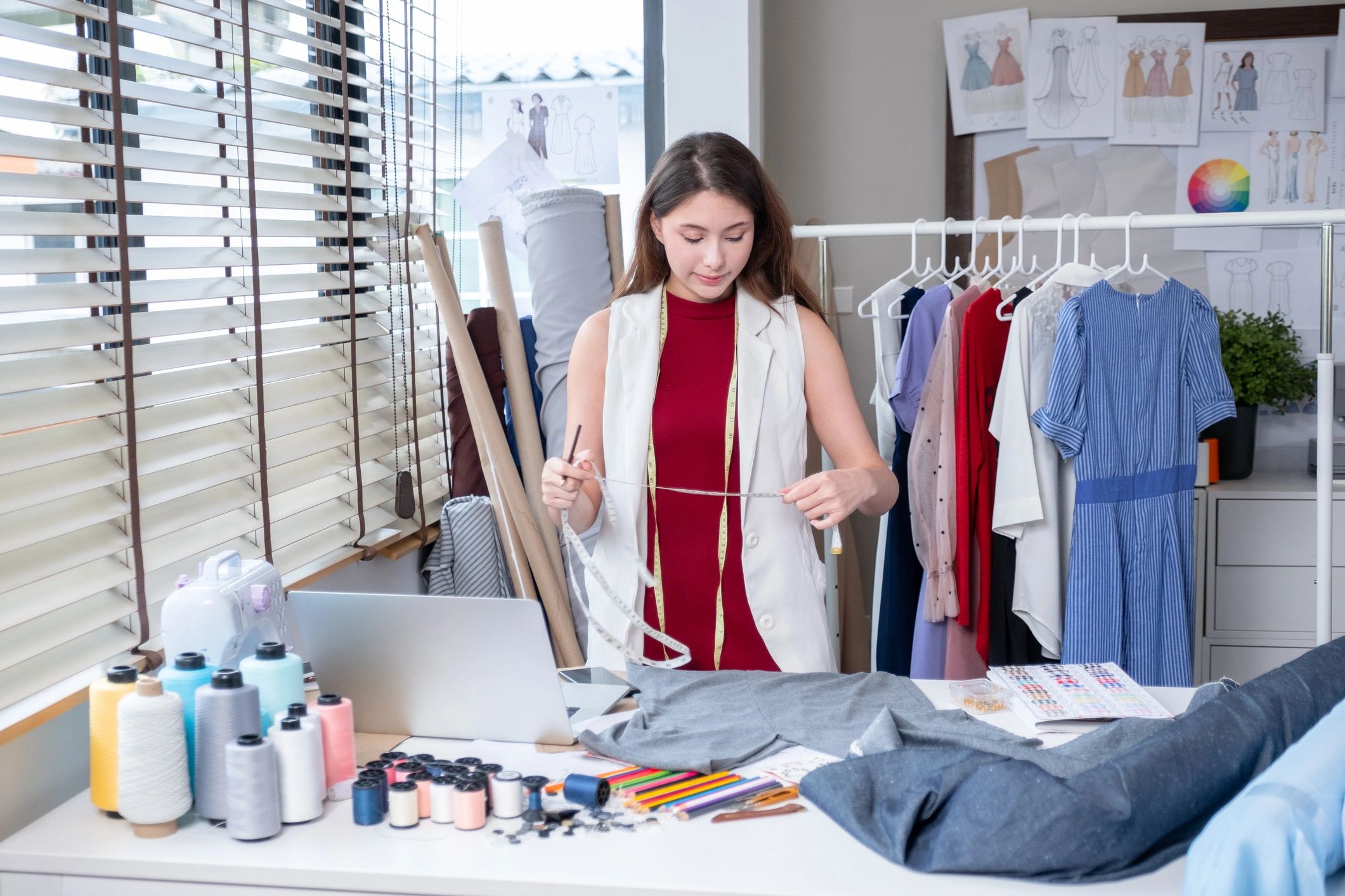 Designer working with fashion materials in a creative studio