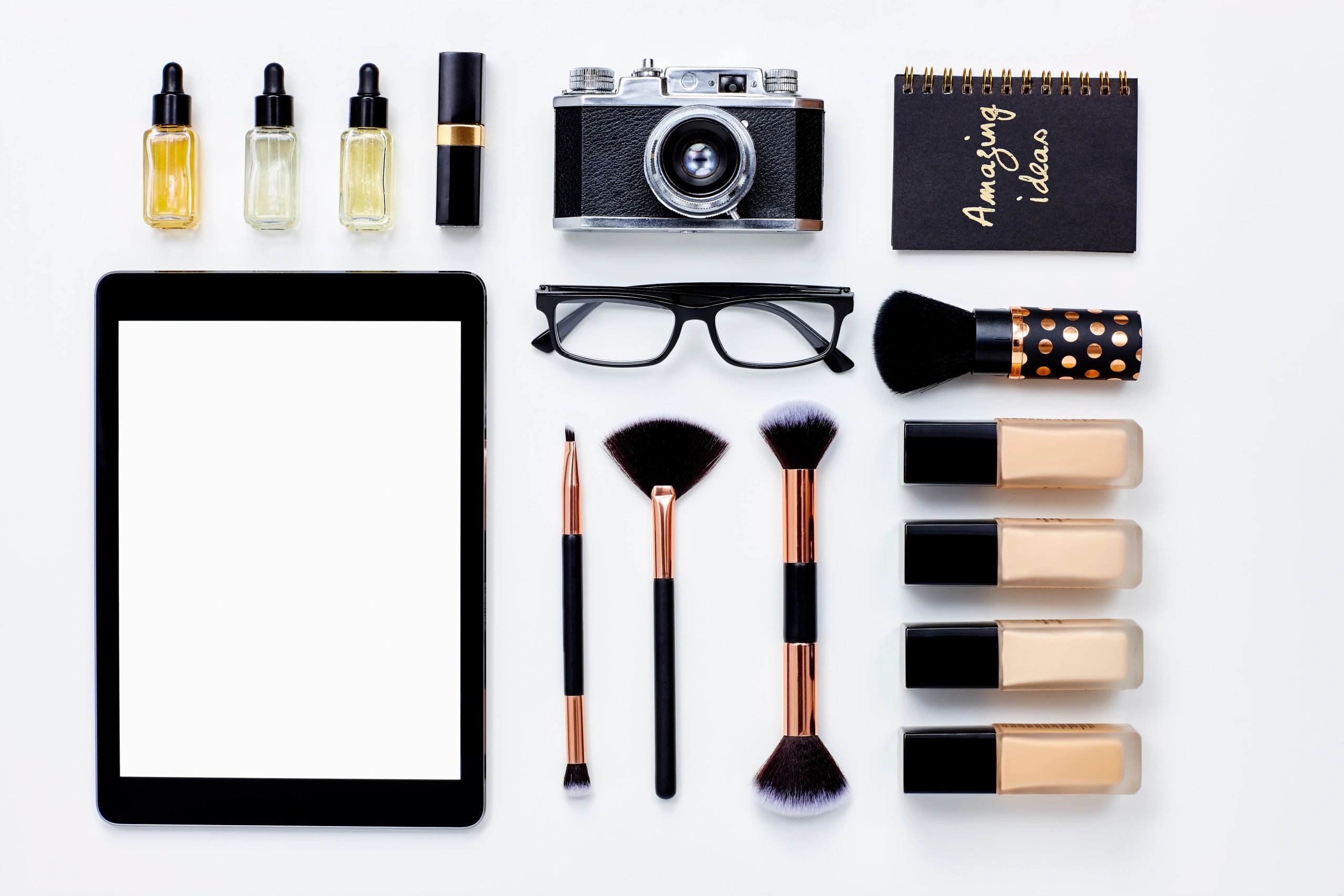 Flat lay of tablet and beauty products for a digital magazine feel