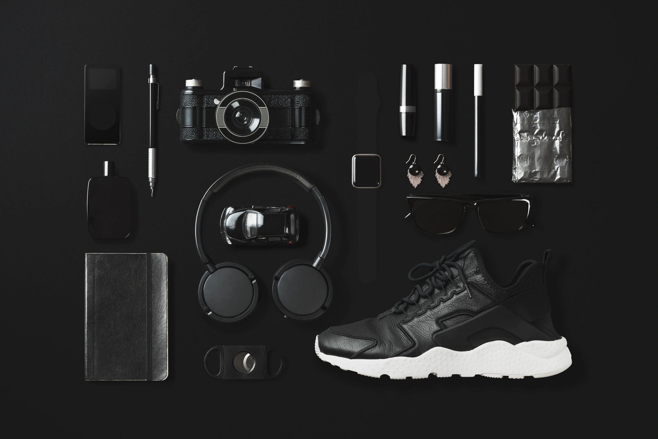Designer accessories and fashion items flat lay